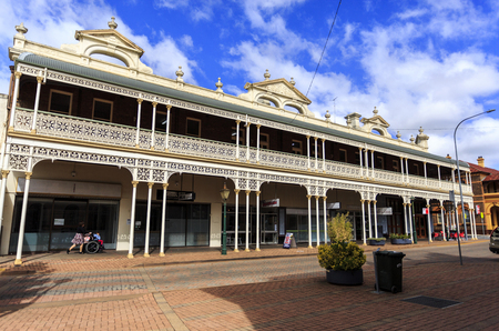 Facade of the heritage listed Imperial Hotel built in 1889 and ornamented with cast-iron friezework, bullnose awnings and parapets with Grecian urns and pediments on arches, in Armidale, NSW, Australiaのeditorial素材
