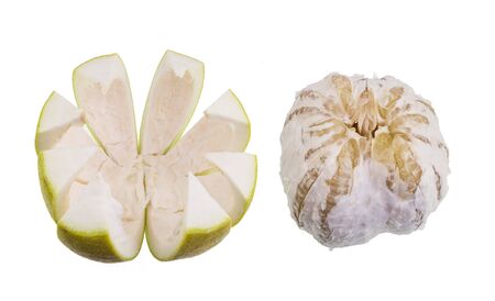 Step 3: pull apart the skin and the edible core of the pomelo. On the left the rind and its spongy pith. On the right the edible core.の写真素材