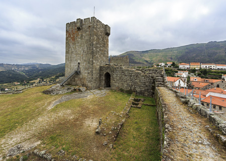 View inside the medieval castle having the historic village of Linhares da Beira, Gouveia, Portugal, in the backgroundのeditorial素材