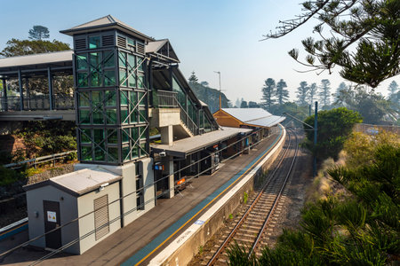 View of the modern staircase, lifts tower and footbridge besides the 1893 Railway Station building...