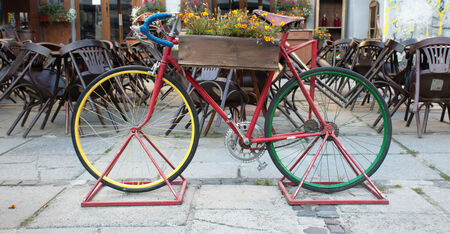 Colorful bike in front of closed cafeのeditorial素材