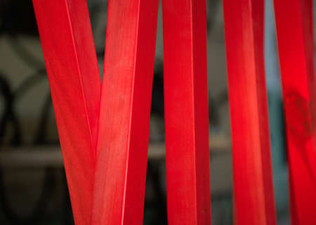 Red wooden fence bars in abstract compositionの写真素材