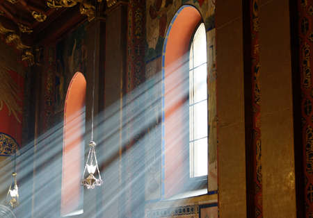 Sunbeams passing through window in Armenian church of Lviv with warm tonesの写真素材