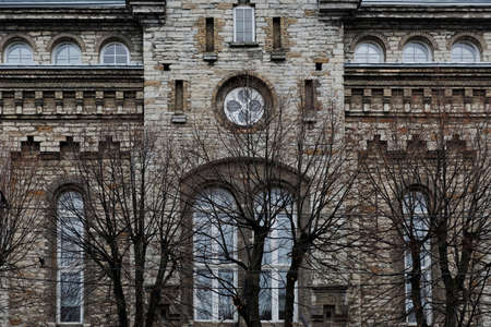 Facade of gray grungy building in the cityの写真素材