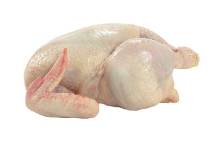 a whole fresh and raw chicken isolated on whiteの写真素材