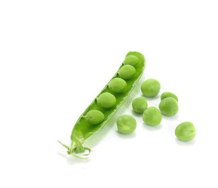 background of open green pea fruit showing seedsの写真素材