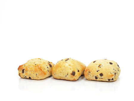 three spongy chocolate chip scones on white background