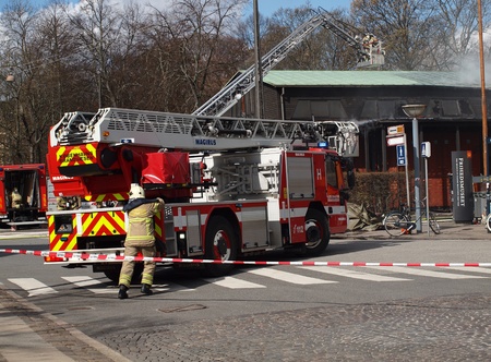 COPENHAGEN - APR 28: Firemen controls fire at The Museum of Danish Resistance 1940 -1945 on April...