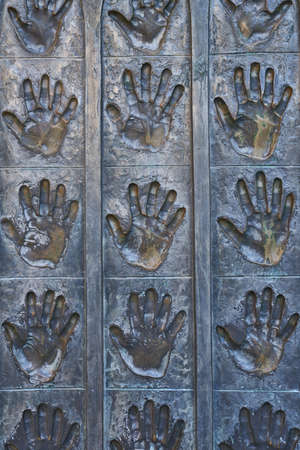 Metal open hands in sculpture in the Plaza de la Catedral de Leon. Spainの写真素材