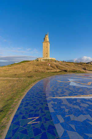 View of the Tower of Hercules in the city of A Coruna, Galicia, with tourists around it.のeditorial素材