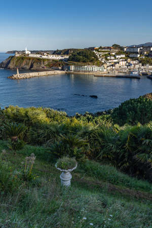 View of the Asturian city of Luarca. In the background the lighthouse and the picturesque cemetery by the sea.の写真素材