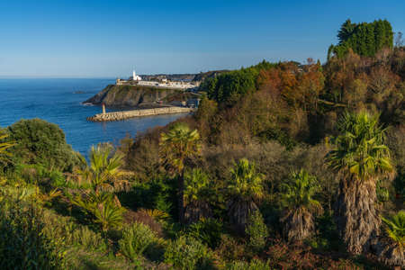 View of the cemetery, the church and the lighthouse of the Asturian city of Luarca, Lluarca,の写真素材