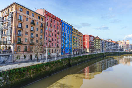 Bilbao, Spain, February 15, 2022. Typical buildings on the banks of the Nervion river in Bilbao, Spain.のeditorial素材