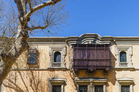 Facade of the Pavilion of Peru with a wooden balcony in the city of Seville, in Spainの写真素材