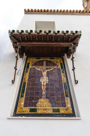 Ecija, Spain, March 9, 2022. Religious image on white facade of the city of Ecija, in Seville, Spainのeditorial素材