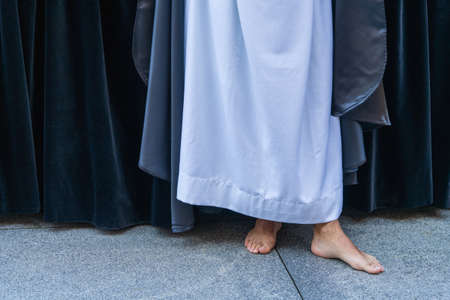 Barefoot man parading in Holy Week procession in the city of Aviles in Asturias.の写真素材
