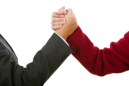Handshake of business partners, men and women in the office