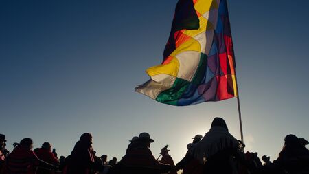 Silohuettes of people dancing around for the celebration of andean amazonic new yearのeditorial素材