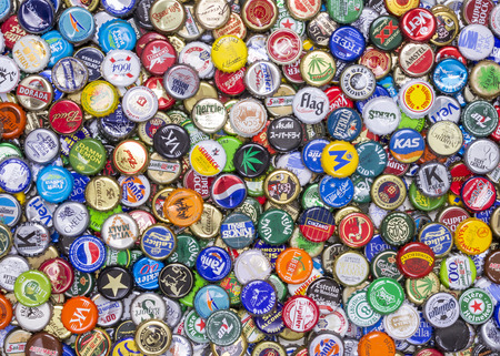 Aerial view of a messy pile of caps of beer, soft drinks, juices and bottled waterのeditorial素材