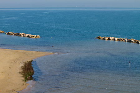 sandy beach with rocks