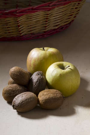 Freshly Picked Kiwi and Apples on Wooden Tableの写真素材