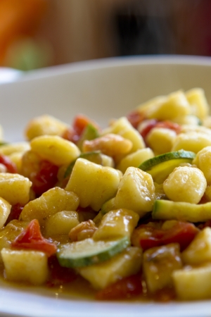 Italian Dish, Gnocchi, tomatoes and Zucchini, selective focusの写真素材
