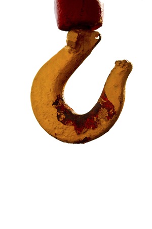 Yellow crane hook isolated on white の写真素材