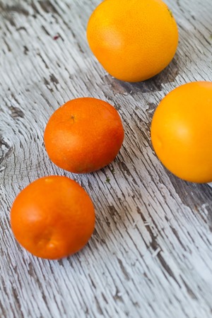 Ripe Tasty Tangerines on Wooden Backgroundの写真素材