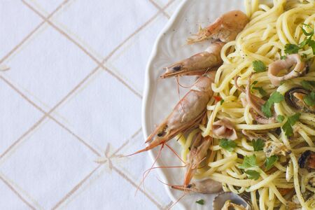 Fresh Spaghetti with king Prawns, Mussels and a chilli and herb sauce.の写真素材
