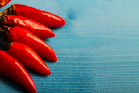 Red Hot Chili Peppers on Blue Wooden Background