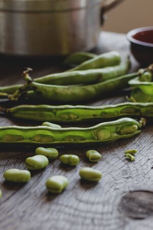 Broad Beans on Grunge Wooden Tableの写真素材