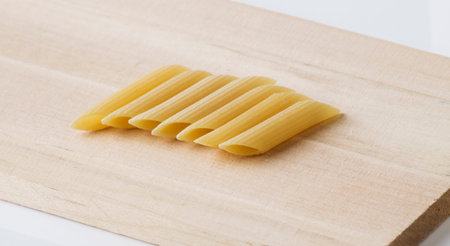 Pasta penne with cutting board