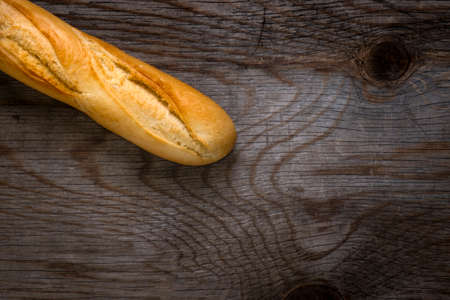 Bread on rustic wooden table with copy spaceの写真素材