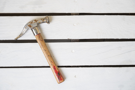 Hammer on white wooden palletの写真素材