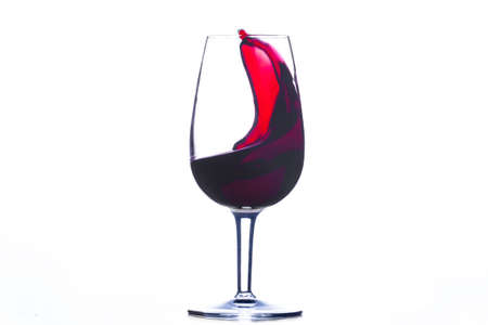 red wine wave in a glass isolated on white backgroundの写真素材
