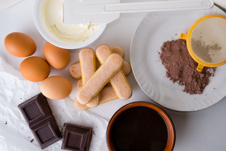 Ingredients for making tiramisu cake on white background, top viewの写真素材
