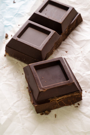 chocolate bars on a baking paper, closeup, top viewの写真素材