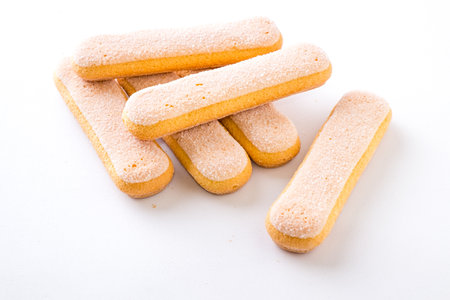 Italian Savoiardi ladyfingers Biscuits on white backgroundの写真素材
