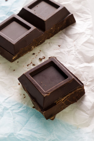 Homemade chocolate bars on paper background. Shallow dof.の写真素材