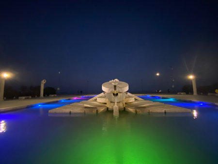 The Nave di Cascella fountain, a prominent landmark in Pescara, Abruzzo, glows with colorful lights at night, creating a captivating sceneの写真素材