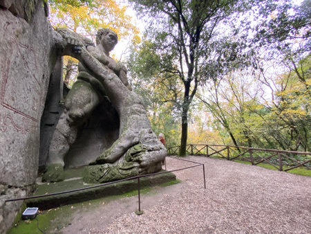 Stone statue of Hercules fighting Cacus in the Sacred Wood, also called Park of the Monsters, an Italian Renaissance garden in Bomarzo, near Viterbo, in the region of Lazio, Italyの写真素材