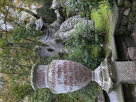 Leaning stone urn with inscription in the park of monsters of Bomarzo, a garden of mannerist...