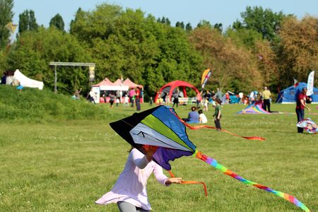 A little girl who play with the kiteの写真素材