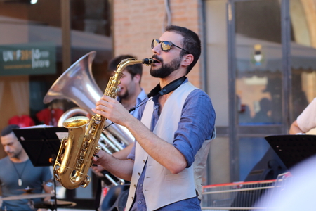 Ferrara, Italia - August 25, 2016: The Ferrara Buskers Festival is dedicated to the art of the street. Peppe Millanta & Balkan BistrÃ², Balkan music band made up of eight young musicians from Abruzzo Balkan music lovers and, more generally, Eastern Europeのeditorial素材