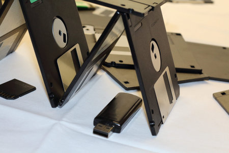 Computer floppy disk closeup on white in a pyramid