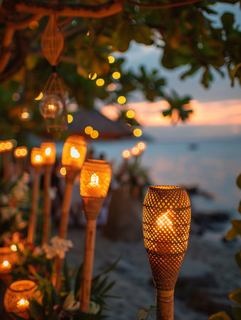 Beachside summer evening party, natural materials, bamboo torches, guests mingling, golden hour lighting, wide-angle view, relaxed and festive ambianceの素材