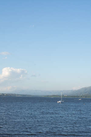 SAILBOAT STRANDED IN LAKE ON A SUNNY DAYの写真素材