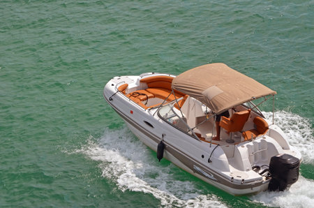 Upscale outboard motor boat cruising on biscayne bay