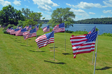 Independence Day flag display on the shores of Lake Gleneida in Carmel,New York,のeditorial素材