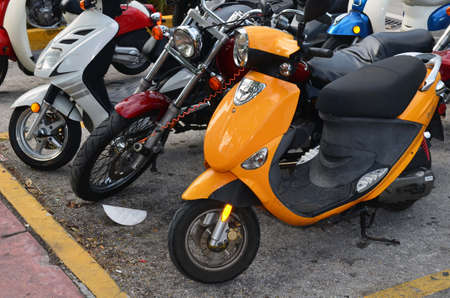 Rental motor bikes parked in a Miami Beach,Florida hotel parking lot.の写真素材